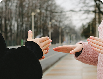 Moment of Hands Sign by Two women's